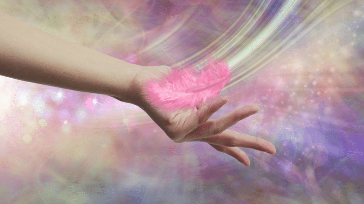 Feather falling into outstretched hand